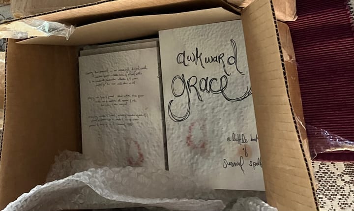 awkward grace... a little book of survival spells is published!